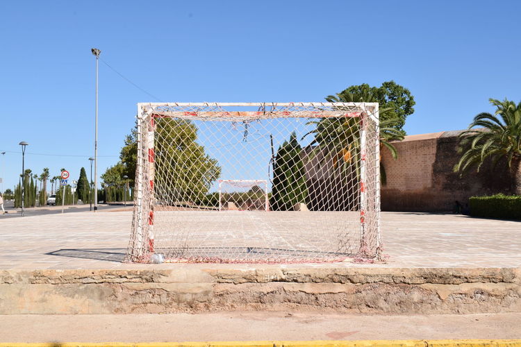View of soccer field against clear sky