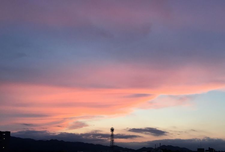 Scenic view of mountains against sky at sunset