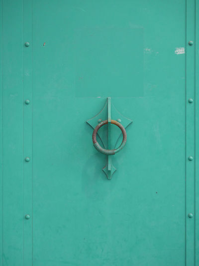 View of doorknob on metallic door