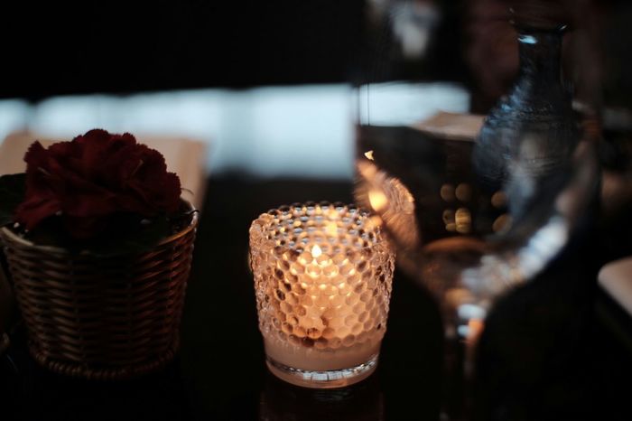 Wine glass lit by candle