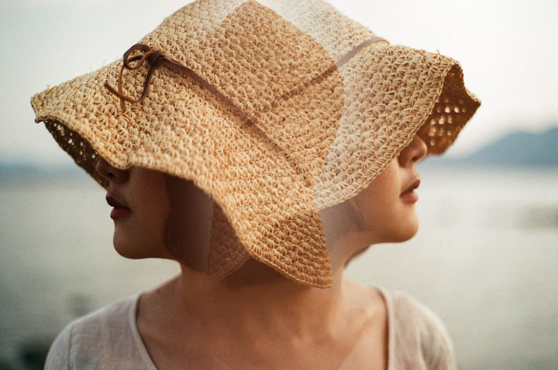 Double exposure of woman at lakeshore