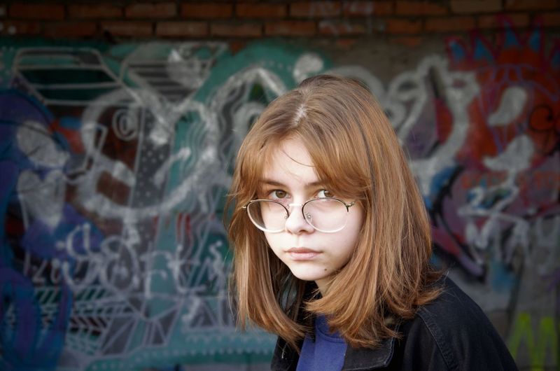 Portrait of a girl in an abandoned building. the brooding teenager