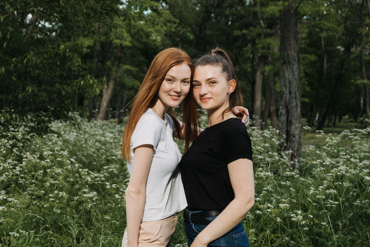 Portrait of smiling women standing outdoors
