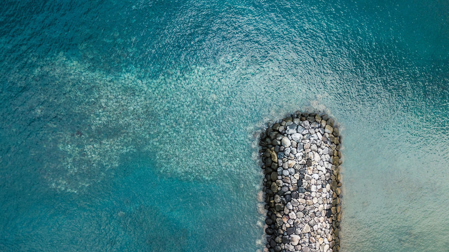 Aerial view of groyne in sea