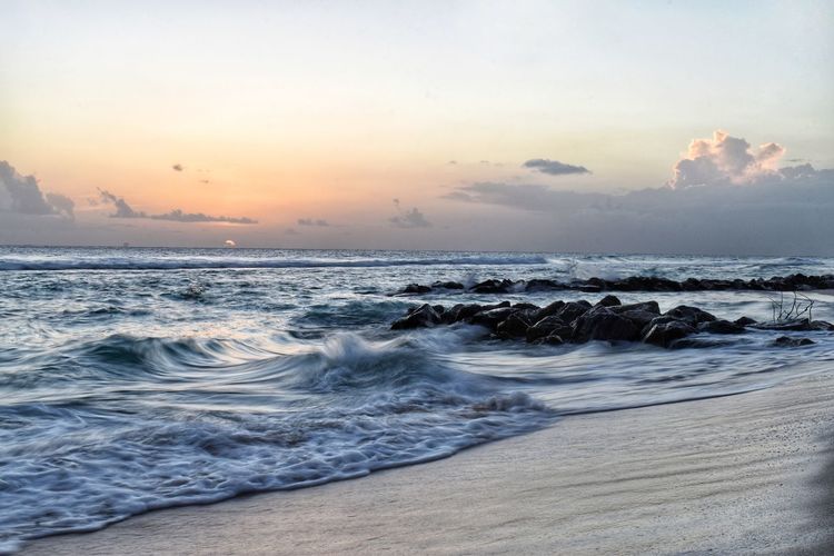 Scenic view of sea against sky during sunset