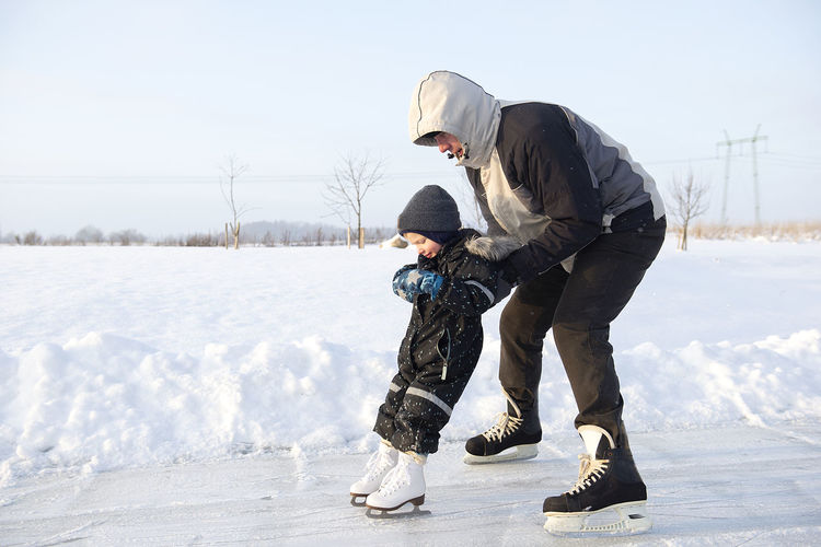 Woman with son on snow