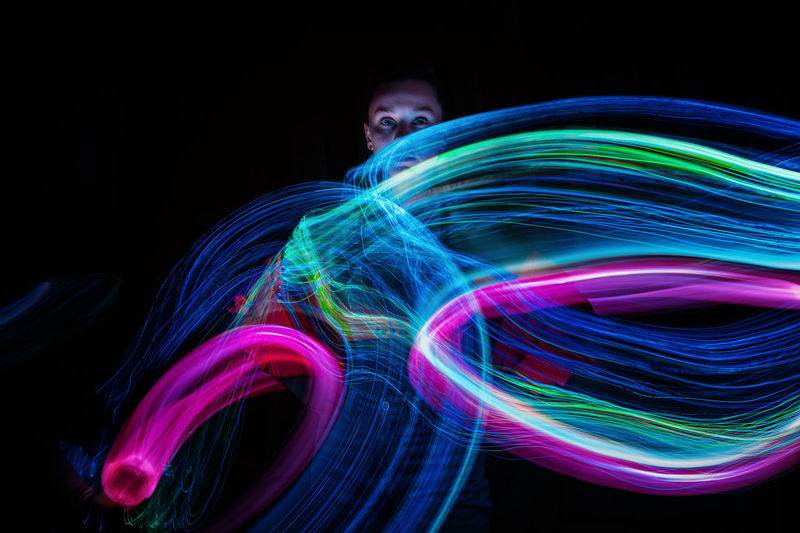 Close-up of light painting against black background