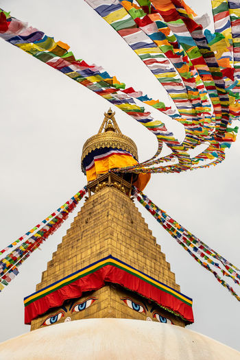 Hundreds of prayer flags waving on the spire of the stupa of boudhanath