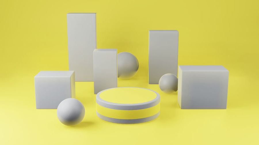 High angle view of objects on table against yellow background