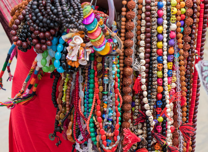 Close-up of multi colored jewelry for sale at market stall