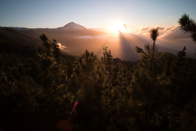 Scenic view of mountains against sky during sunset