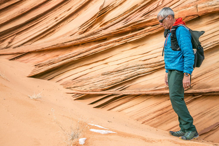 Man and lace rock in vermilion cliffs, south coyote buttes