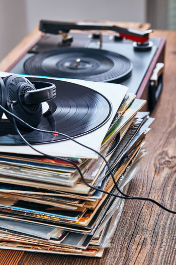 Close-up of turntable with headphones and records on table