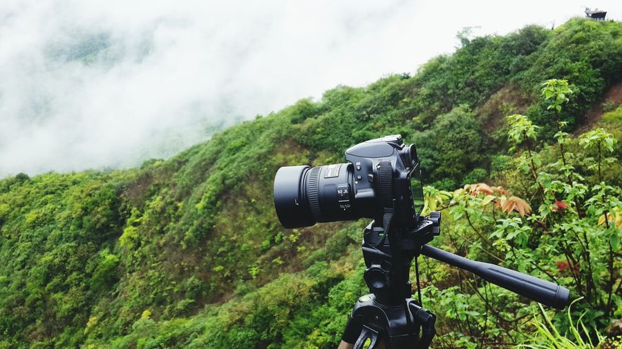 Camera on mountain during foggy weather