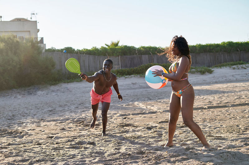 Full length of woman standing on beach