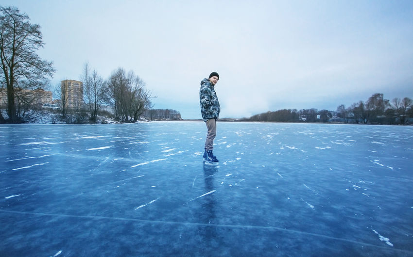 Full length of man on frozen lake