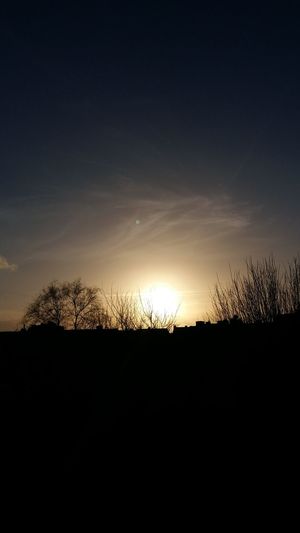 Silhouette landscape against sky during sunset