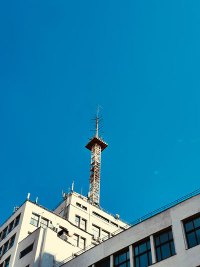 Low angle view of building against blue sky