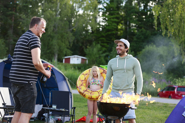 Family having barbecue on campsite