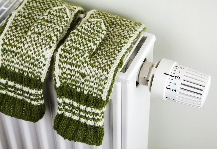 High angle view of gloves on radiator at home
