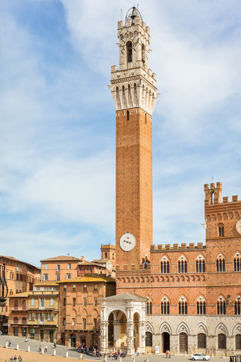 Palazzo pubblico with the clock tower in siena, italy
