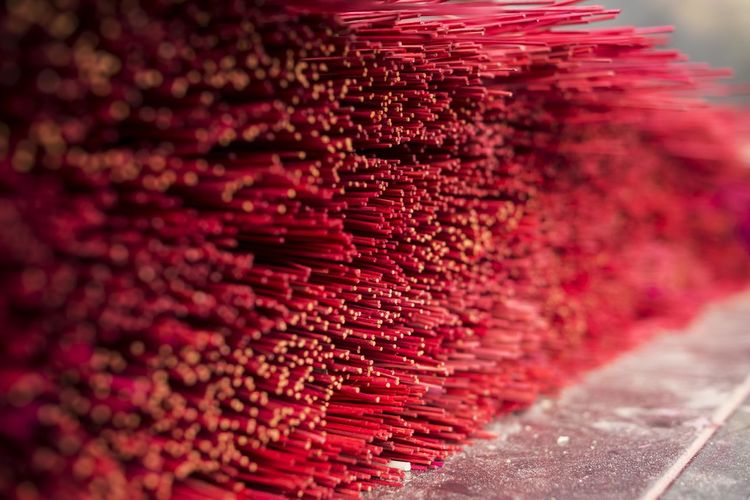 Red incense sticks in temple