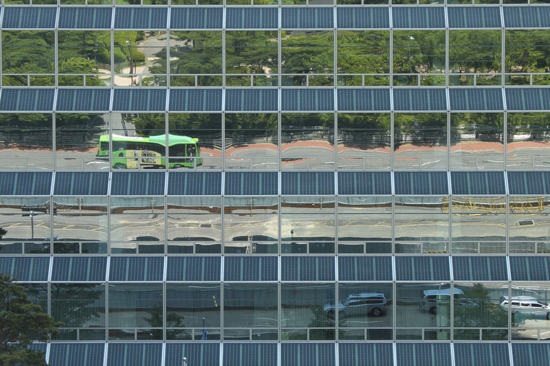 Reflection of building on glass window