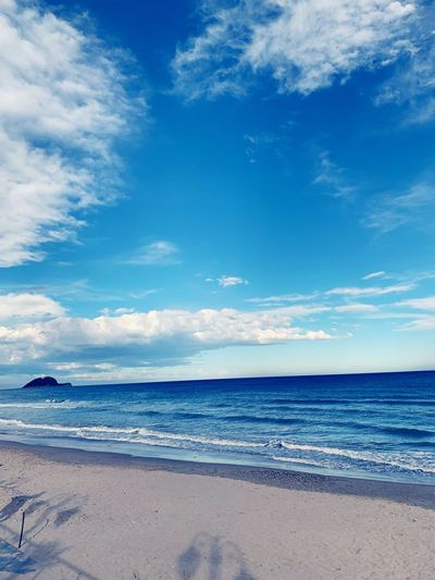 Scenic view of beach against sky