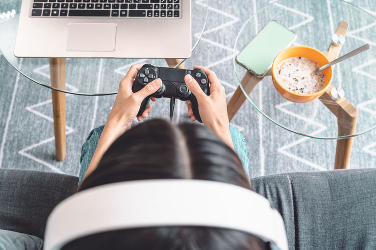 High angle view of woman playing video game