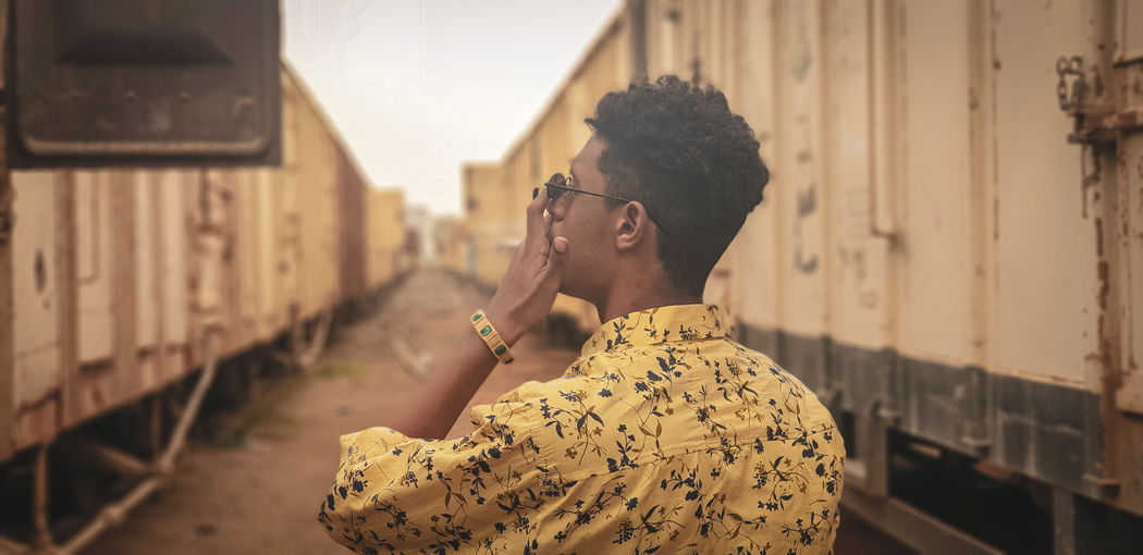 Side view of young man looking away