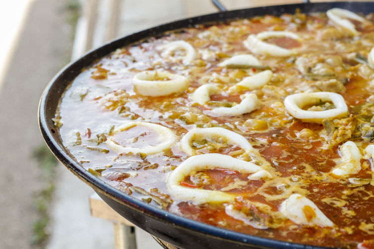 Cooking typical spanish seafood paella