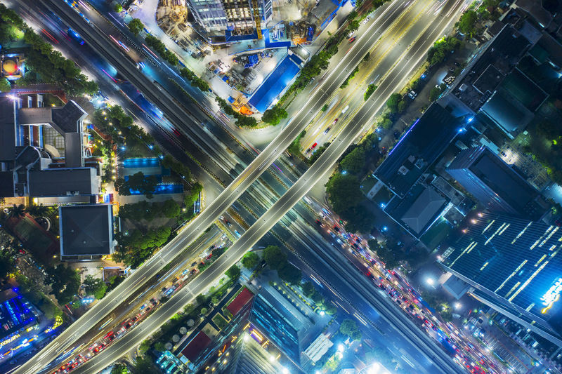 Aerial view of buildings in city against sky
