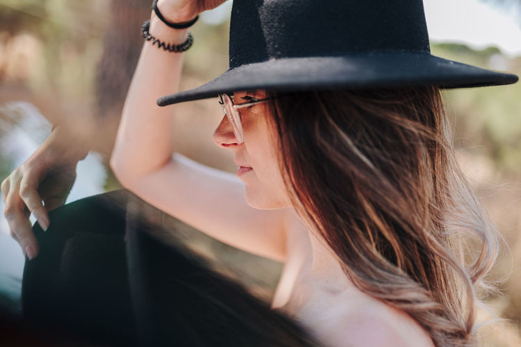 Portrait of woman wearing hat