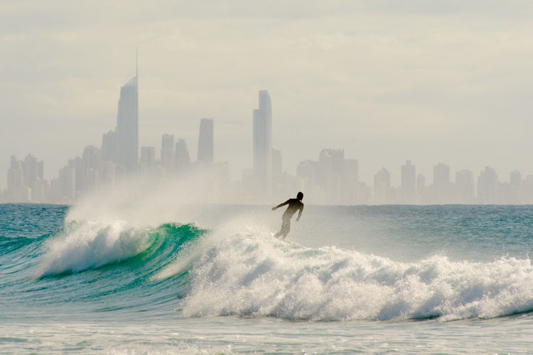 Man surfing on sea waves at surfers paradise