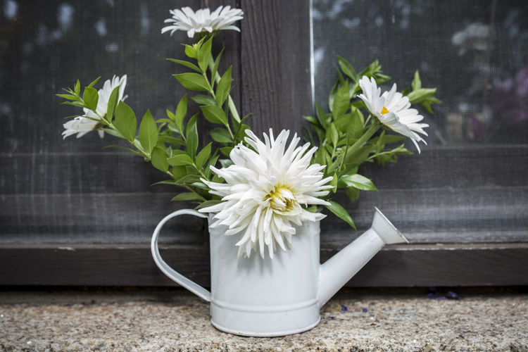 Close-up of white flower vase on table