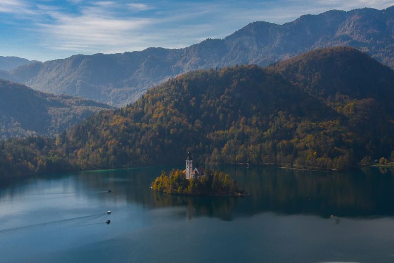 Scenic view of lake and mountains against sky