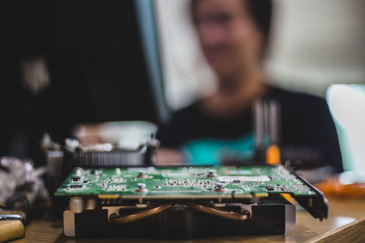 Close-up of mother board on table in workshop
