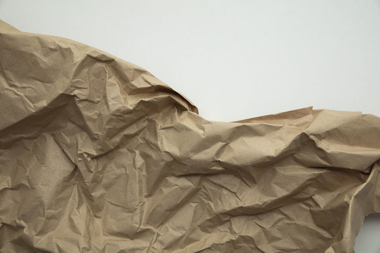 Close-up of crumpled paper against white background