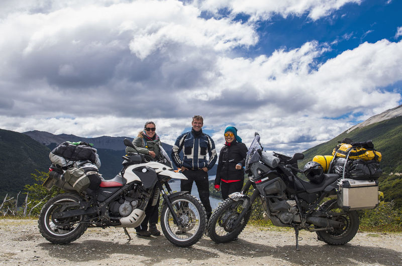 Three bikers posing behind their motorbikes in tierra del fuego
