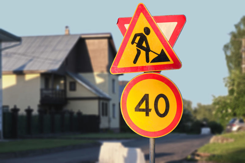 Forbidding speed limit road sign, warning road sign of repair work