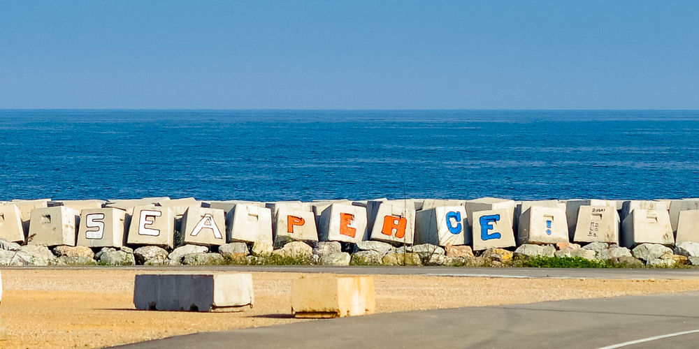 Scenic view of sea against clear blue sky
