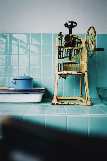 A vintage snow ice maker on mint green kitchen counte