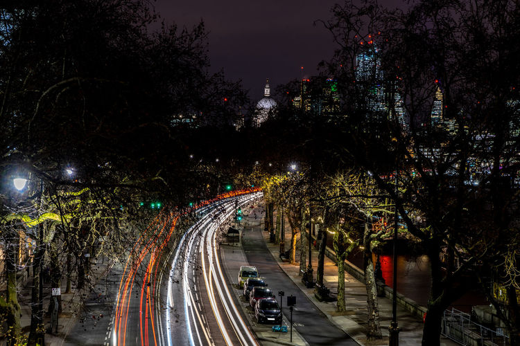 High angle view of light trails on street in city at night