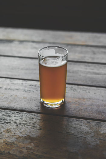 Close-up of beer glass on table