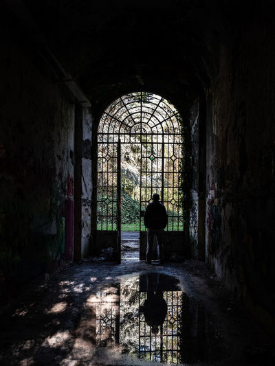 Man standing in old abandoned building