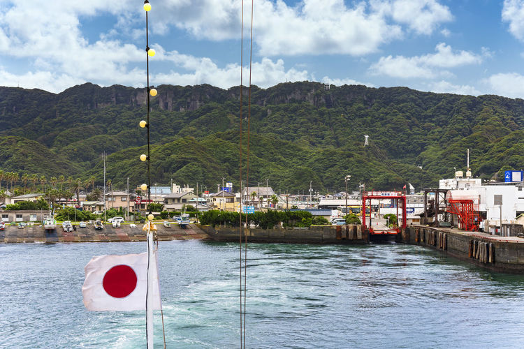 Coast of the kanaya port from the kanayamaru ferry along the uraga channel with the mount nokogiri.