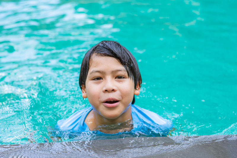 Portrait of boy in swimming pool