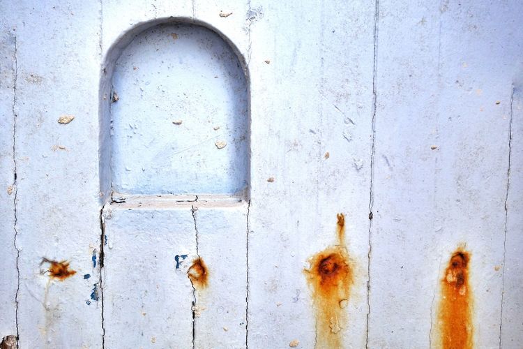 Close-up of niche on white wooden wall