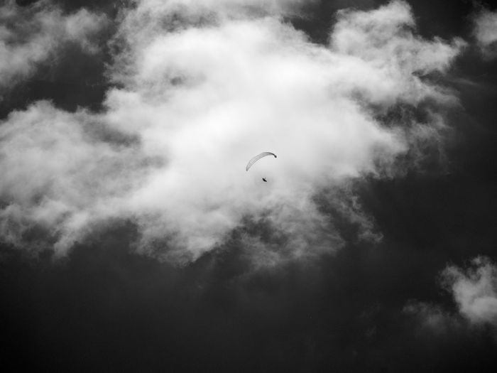 Low angle view of paraglider in sky