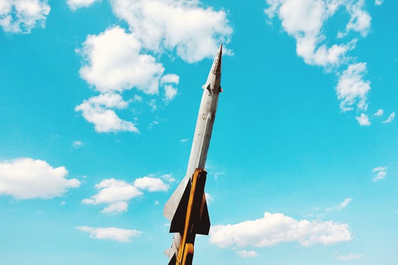 Low angle view of missile against blue sky